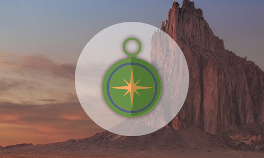 A cartoon compass centered with a hill background.