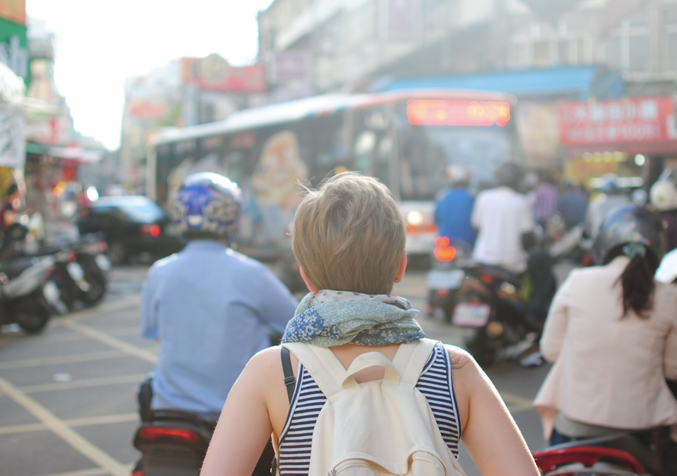 Girl walking through a crowd