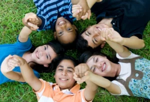 Five middle school children holding hands