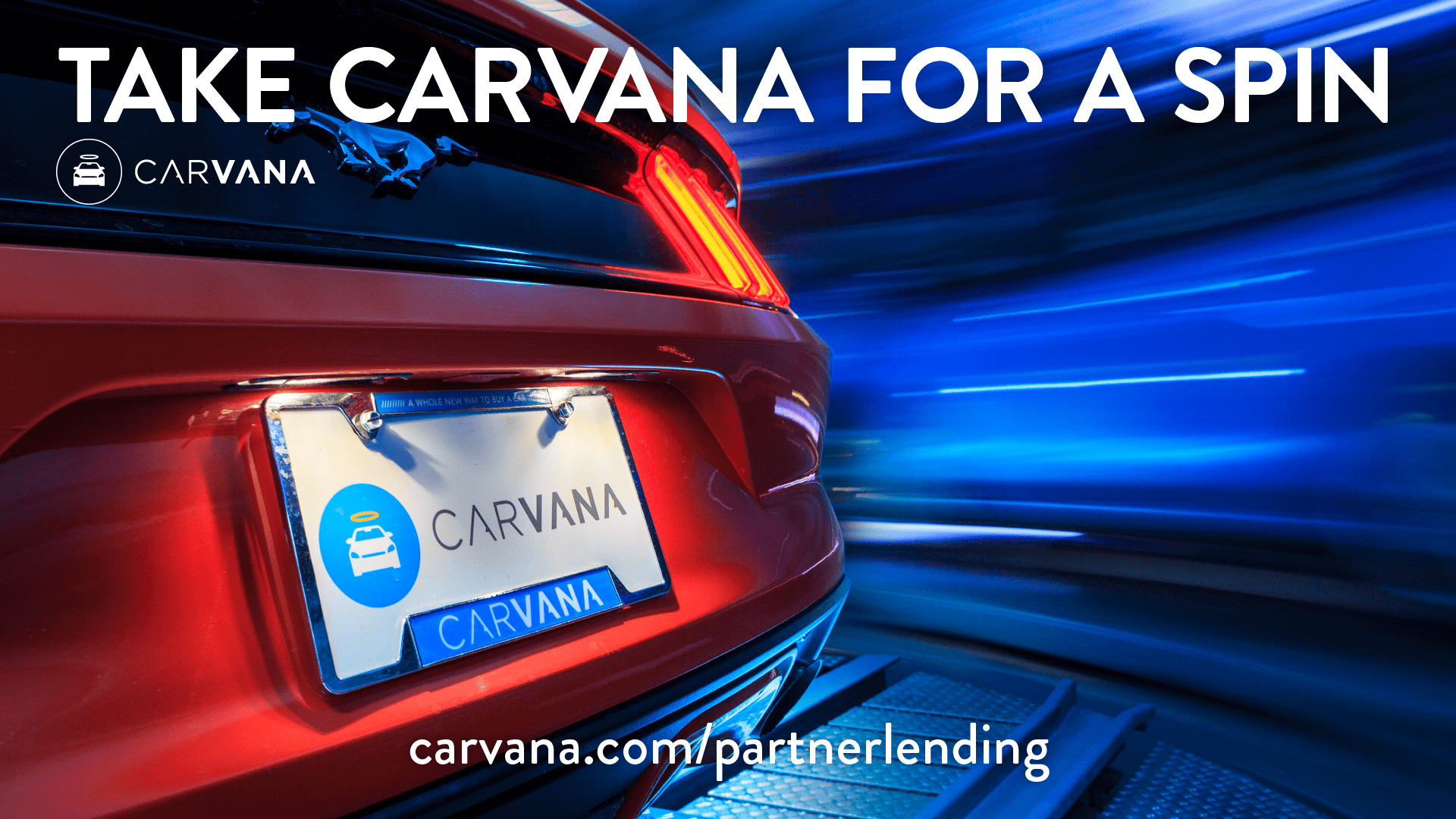 Take Carvana For A Spin- Carvana.com/partnerlending- Red Ford Mustang bumper.