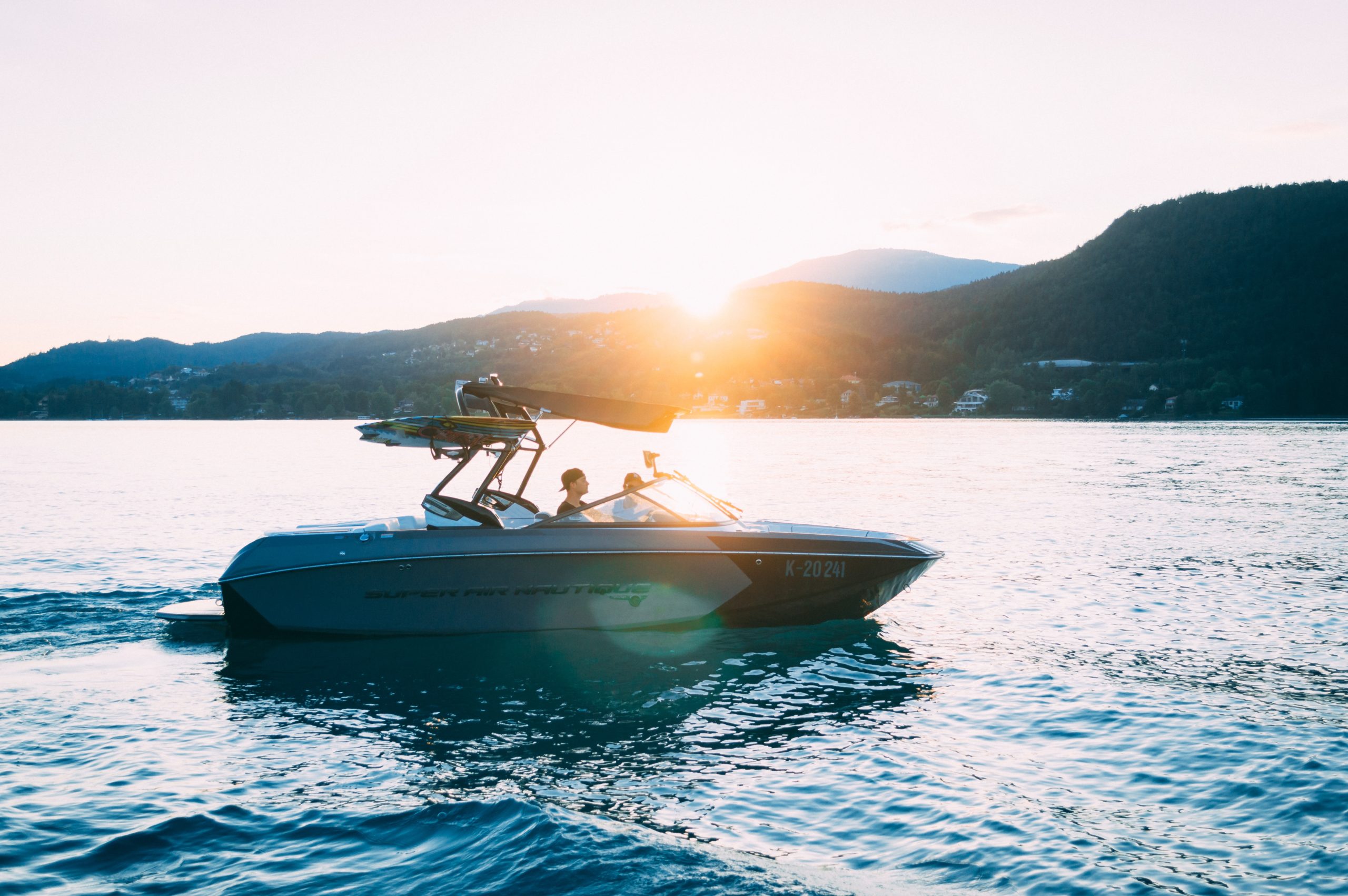 people in a boat on a lake