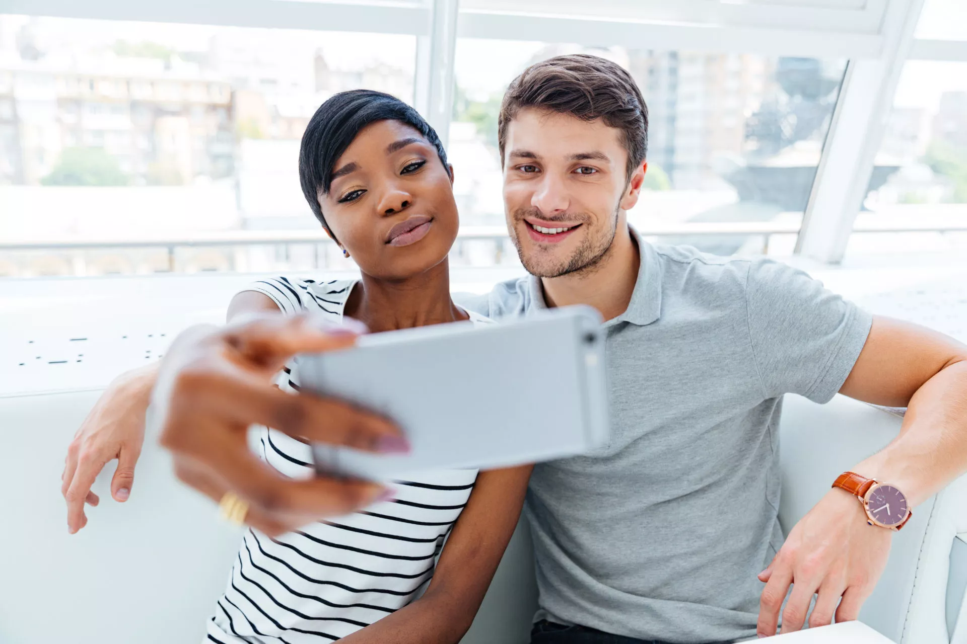 mixed race couple taking a selfie