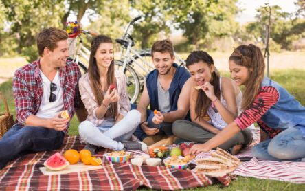 high school students outside having a picnic